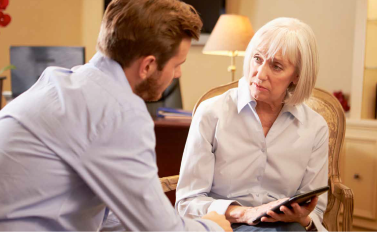 Female therapist looks at male client