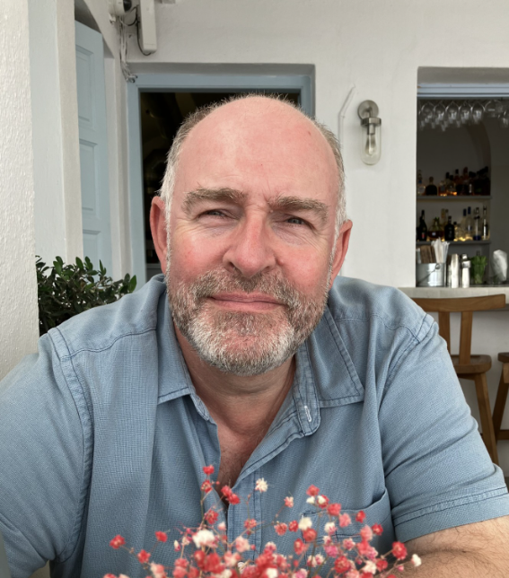 Man sitting down and smiling