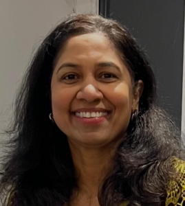 Lady smiling, with long brown hair